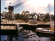 Warrior18.png (750 KB) The red and grey bulldozer behind the The Quarry Master's office in Warrior (Episode)