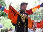 Misha with a beard sorting through underwear