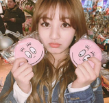 Jihyo holding to plushies