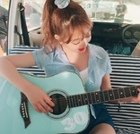 Jihyo playing the guitar