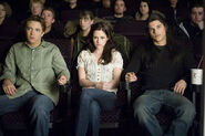 Mike, Bella, and Jacob Black at the movies, watching Face Punch.