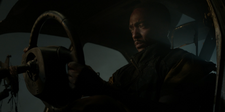 John Doe in a wrecked Evelyn.