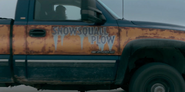 "Snowsquall Plow" painted on the door.