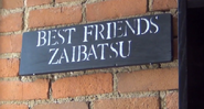 The Best Friends Zaibatsu sign in Matt's apartment, as seen in TOP TEN MOVIES!