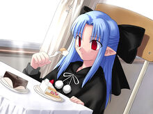 Len eating a cake