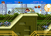 The player runs to the right as they fire the machine gun.