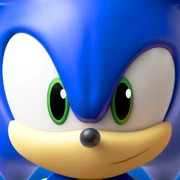 Sonic the Hedgehog runs to the left whilst looking at the player in front of a blurred background.