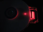 DVD-RW Drive operating with the protective cover removed.