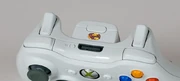 Shoulder buttons ("bumpers") and triggers on an Xbox 360 controller.