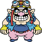 An overweight character with pointy ears, a pink nose, thick eyebrows, muscular arms and a wavy moustache. He wears a navy blue shirt with a light blue jacket, pink pants with a red belt, blue shoes, and yellow biker gloves with a blue W. On his head, a yellow biker helmet with a blue W, goggles, and a red strap.