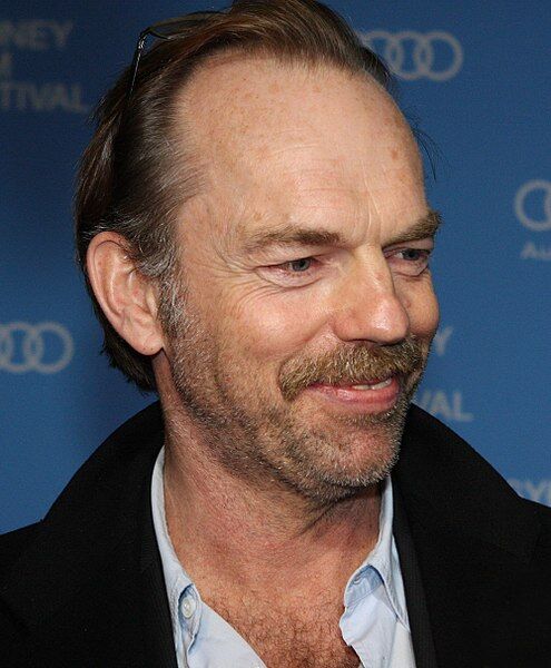 Hugo Weaving speaks to a TV reporter upon his arrival for the Tokyo premier  of his latest film V for Vendetta Monday, April 17, 2006. The political  action thriller, that stars Weaving