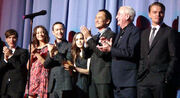 A photograph of the cast of the 2010 film Inception, including Elliot Page in the middle