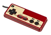 A  controller. The D-pad (cross shape on left) first came to prominence on the controller for the Famicom.