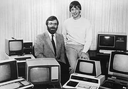  and  pose for the camera on October 19, 1981, in a sea of PCs after signing a pivotal contract with IBM