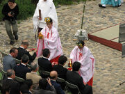 Miko perform Shinto ceremony near the 
