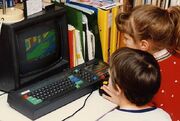 Children playing  on the CPC 464 in 1988