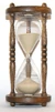 The flow of sand in an hourglass can be used to measure the passage of time. It also concretely represents the present as being between the past and the future.