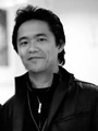 Junichi Masuda (pictured in 2007) composed the music for all versions.