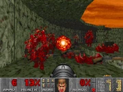 Doom's intense level of graphic violence made the game highly controversial, as seen in this gory effect of a rocket hitting a group of demons.