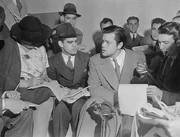  explaining to reporters about his radio drama "" on Sunday, October 30, 1938, the day after the broadcast