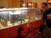 's Gun Fight (1969), a two-player EM game that used light-sensitive targets. It was one of the first games with head-to-head shooting, inspiring arcade  such as  (1975)