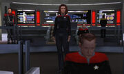 A computer-rendered version of the bridge featured in Star Trek: Voyager. A woman gives orders from the center of the room, while a man works on a console in the foreground. The ship's executive officer sits in a chair to the right, and a crewman works on a panel with the ship's schematics in the background. To the left, a man in an armored uniform watches the activity.