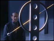 Dan swearing to his fallen colleague that he will protect the Earth despite the ongoing aggression plot implemented by TDF