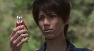 Hikaru holding the Ultraman Taro Spark Doll