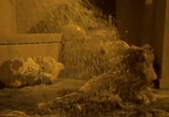 Zuckal's wife and children are killed by Gamos's acid.