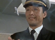 Captain of the supersonic airliner SST, played by Rinsaku Ogata