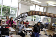 Sadora showing off his extending arms power to the other students.