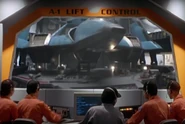 GX00030.jpg (179 KB) Peace Carry moving to the A1 flight deck via a rotating lift platform.