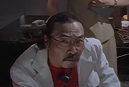 KCB staff member, played by Hirochika Muraishi.