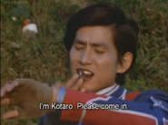 Kotaro receives a report from ZAT while eating with his brothers