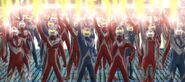 A group of Ultramen giving their energy to Ultraman Zero