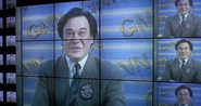 Dan as a Newscaster in Ultraman Zearth 2: Superhuman Big Battle - Light and Shadow