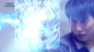 Gai using Ultraman's Fusion Card to block Alien Zetton’s attack