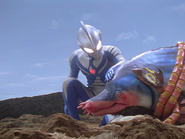 Cosmos petting Mogrudon while it is sleeping.