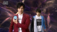 Katsumi holds the Kiwami Crystal while Isami stands by