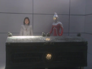 A Nonmalt (in her human disguise) and Ultraseven with the ancient casket (identified as an OOPArt)