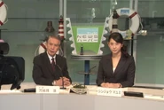 Jun appears as a TV anchor with Mayumi Shinjoh