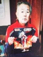 Narita holding poster of Ultraman Millennium