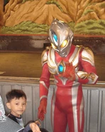 Ultraman Max playing with a kid