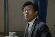 Kobayashi as Taizo Machida in Operation: Mystery