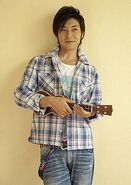 Takeshi with a guitar