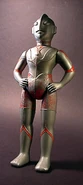 12-1/2 inch tall Marusan Ultraman, 1966. This particular toy was sold in this silver finish, so kids could paint the red color them selves. Also known as a "poly vinyl" doll.