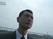 Seiichiro observing Ginga's fight in Episode 9