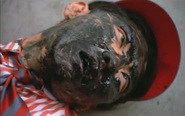 Katsuto with his face full of tar