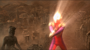 Daigo (as Ultraman Tiga) uses Zeperion Beam