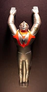 1966, Takutoku Toys (logo is TT), Ultraman sprinkling toy.12-1/2 inches long. Gold Tsuburaya sticker copyright under arm. They also made a Ultraseven figure in the same pose.